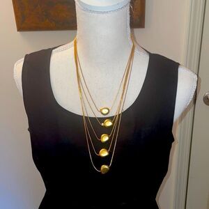 Gold tone necklace drape